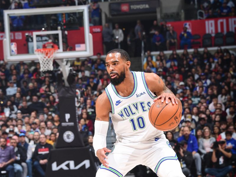 LOS ANGELES, CA - FEBRUARY 12:  Mike Conley #10 of the Minnesota Timberwolves handles the ball during the game  on February 12, 2024 at Crypto.Com Arena in Los Angeles, California. NOTE TO USER: User expressly acknowledges and agrees that, by downloading and/or using this Photograph, user is consenting to the terms and conditions of the Getty Images License Agreement. Mandatory Copyright Notice: Copyright 2024 NBAE (Photo by Adam Pantozzi/NBAE via Getty Images)