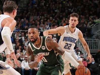 MILWAUKEE, WI - DECEMBER 21:  Damian Lillard #0 of the Milwaukee Bucks handles the ball during the game against the Orlando Magic on December 21, 2023 at the Fiserv Forum Center in Milwaukee, Wisconsin. NOTE TO USER: User expressly acknowledges and agrees that, by downloading and or using this Photograph, user is consenting to the terms and conditions of the Getty Images License Agreement. Mandatory Copyright Notice: Copyright 2023 NBAE (Photo by Gary Dineen/NBAE via Getty Images).