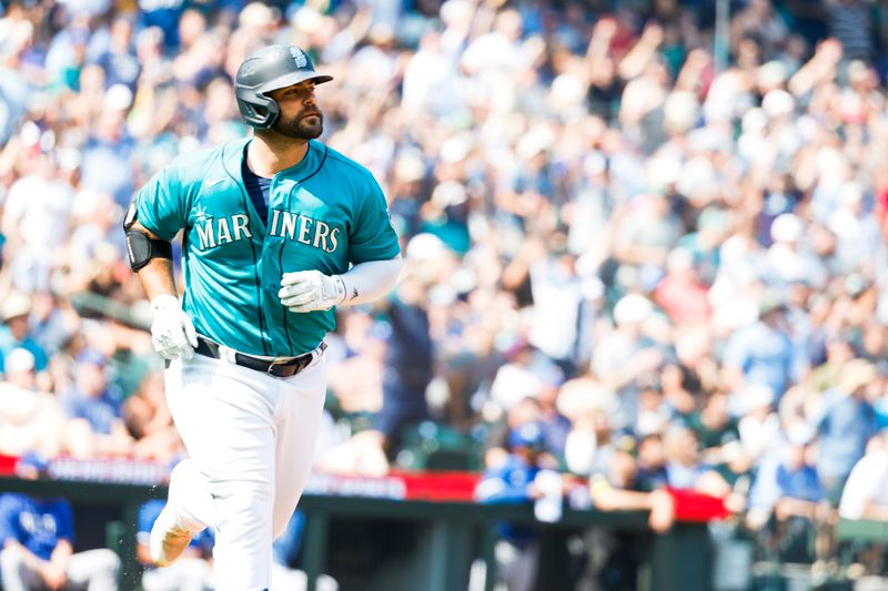 Aug 28, 2023; Seattle, Washington, USA; Seattle Mariners designated hitter Mike Ford (20) watches his two-run home run against the Kansas City Royals during the third inning at T-Mobile Park. Mandatory Credit: Joe Nicholson-USA TODAY Sports