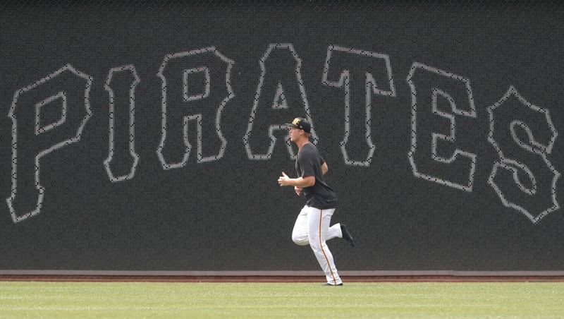 Jul 4, 2024; Pittsburgh, Pennsylvania, USA; Pittsburgh Pirates pitcher Mitch Keller (23) jogs in the outfield before a game against the St. Louis Cardinals at PNC Park. Mandatory Credit: Charles LeClaire-USA TODAY Sports