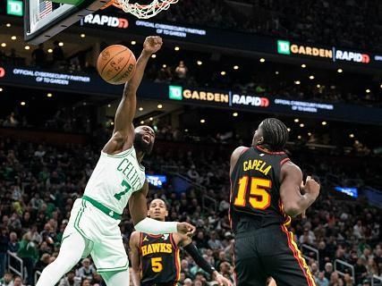 Boston, MA - November 26: Boston Celtics SG Jaylen Brown dunks on Atlanta Hawks C Clint Capela in the second quarter. The Celtics beat the Hawks, 113-103. (Photo by Tanner Pearson/The Boston Globe via Getty Images)