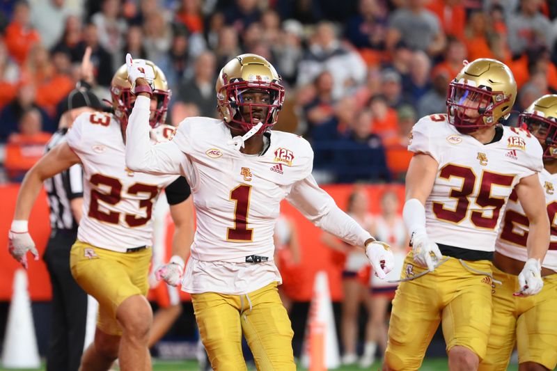 Nov 3, 2023; Syracuse, New York, USA; Boston College Eagles defensive back Elijah Jones (1) celebrates his interception with teammates against the Syracuse Orange during the first half at the JMA Wireless Dome. Mandatory Credit: Rich Barnes-USA TODAY Sports