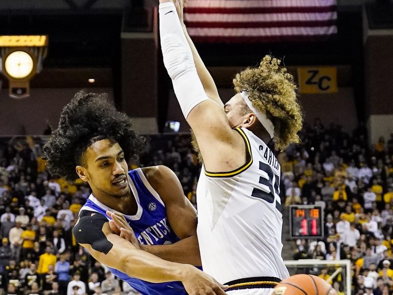 Dec 28, 2022; Columbia, Missouri, USA; Kentucky Wildcats forward Jacob Toppin (0) passes the ball as Missouri Tigers forward Noah Carter (35) defends during the first half at Mizzou Arena. Mandatory Credit: Jay Biggerstaff-USA TODAY Sports