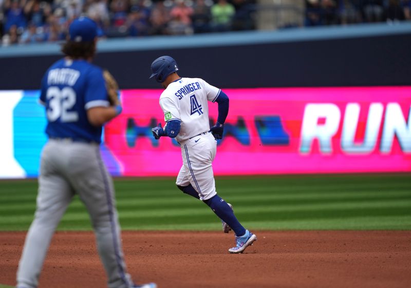 Sep 9, 2023; Toronto, Ontario, CAN; Toronto Blue Jays right fielder George Springer (4) runs the bases after hitting a home run against the Kansas City Royals during the seventh inning at Rogers Centre. Mandatory Credit: Nick Turchiaro-USA TODAY Sports