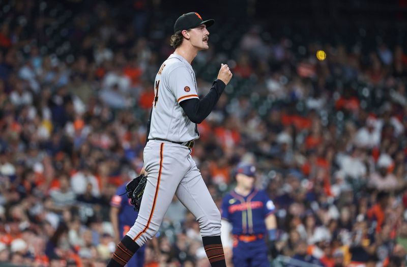 May 1, 2023; Houston, Texas, USA; San Francisco Giants relief pitcher Sean Hjelle (64) reacts after a play during the seventh inning against the Houston Astros at Minute Maid Park. Mandatory Credit: Troy Taormina-USA TODAY Sports