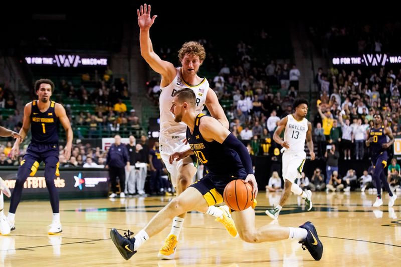 Feb 13, 2023; Waco, Texas, USA; West Virginia Mountaineers guard Erik Stevenson (10) works past Baylor Bears forward Caleb Lohner (33) during the first half at Ferrell Center. Mandatory Credit: Raymond Carlin III-USA TODAY Sports