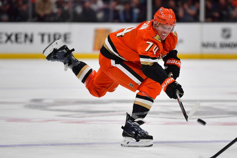 Mar 18, 2026; Anaheim, California, USA; Anaheim Ducks defenseman John Carlson (74) shoots on goal against the Philadelphia Flyers during the second period at Honda Center. Mandatory Credit: Gary A. Vasquez-Imagn Images