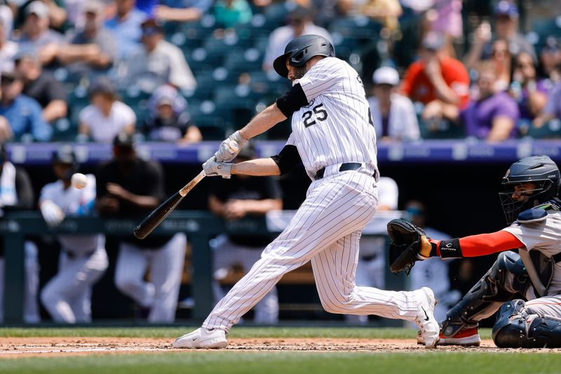 Jul 24, 2024; Denver, Colorado, USA; Colorado Rockies catcher Jacob Stallings (25) hits a single and reaches second on a field error in the second inning against the Boston Red Sox at Coors Field. Mandatory Credit: Isaiah J. Downing-USA TODAY Sports