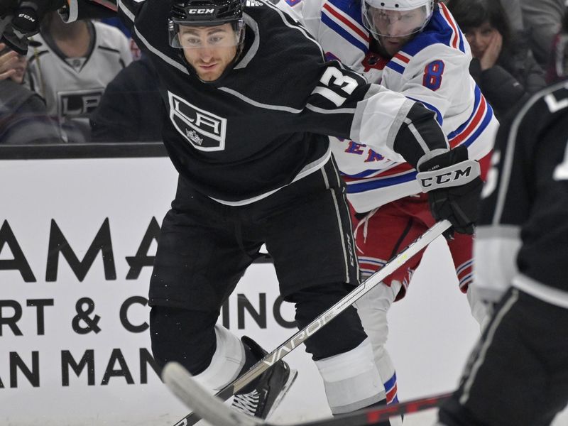 Nov 22, 2022; Los Angeles, California, USA;  Los Angeles Kings right wing Gabriel Vilardi (13) and New York Rangers defenseman Jacob Trouba (8) battle for the puck in the first period at Crypto.com Arena. Mandatory Credit: Jayne Kamin-Oncea-USA TODAY Sports