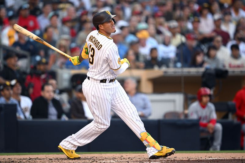 Jul 5, 2023; San Diego, California, USA; San Diego Padres third baseman Manny Machado (13) watches his RBI single against the Los Angeles Angels during the third inning at Petco Park. Mandatory Credit: Orlando Ramirez-USA TODAY Sports