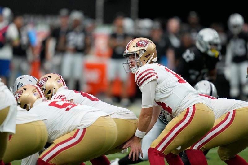 San Francisco 49ers quarterback Sam Darnold (14) plays against the Las Vegas Raiders during an NFL football game, Sunday, Aug. 13, 2023, in Las Vegas. (AP Photo/John Locher)