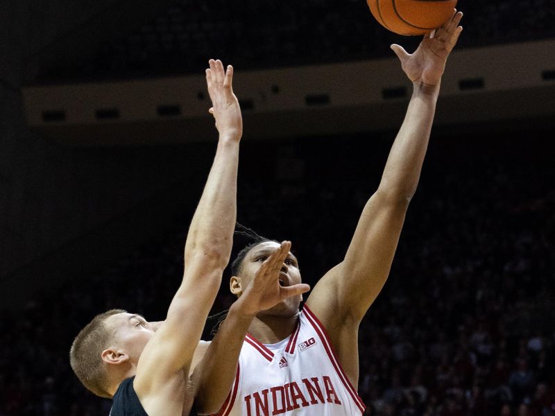 Jan 22, 2023; Bloomington, Indiana, USA; Indiana Hoosiers forward Malik Reneau (5) shoots the ball while Michigan State Spartans forward Joey Hauser (10) defends in the first half at Simon Skjodt Assembly Hall. Mandatory Credit: Trevor Ruszkowski-USA TODAY Sports