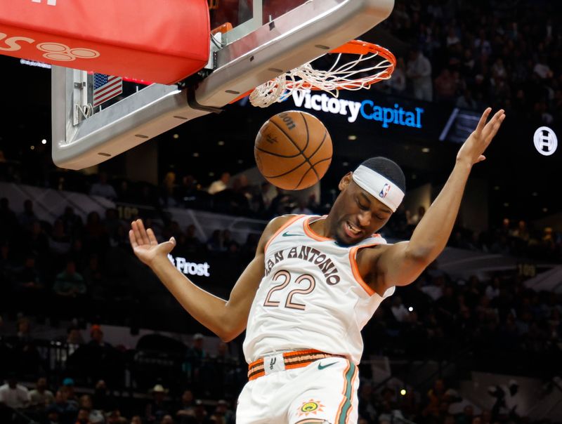 SAN ANTONIO, TX - MARCH 19:  Malaki Branham #22 of the San Antonio Spurs dunks on the Dallas Mavericks in the first half at Frost Bank Center on March 19, 2024 in San Antonio, Texas. NOTE TO USER: User expressly acknowledges and agrees that, by downloading and or using this photograph, User is consenting to terms and conditions of the Getty Images License Agreement. (Photo by Ronald Cortes/Getty Images)