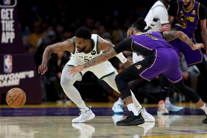 LOS ANGELES, CALIFORNIA - MARCH 08: Malik Beasley #5 of the Milwaukee Bucks steals the ball from D'Angelo Russell #1 of the Los Angeles Lakers during the first half of a game at Crypto.com Arena on March 08, 2024 in Los Angeles, California. (Photo by Sean M. Haffey/Getty Images)