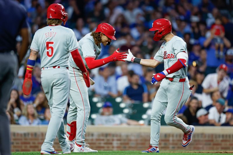 Jul 2, 2024; Chicago, Illinois, USA; Philadelphia Phillies shortstop Trea Turner (7) celebrates with third baseman Alec Bohm (28) after hitting a two-run home run against the Chicago Cubs during the fifth inning at Wrigley Field. Mandatory Credit: Kamil Krzaczynski-USA TODAY Sports