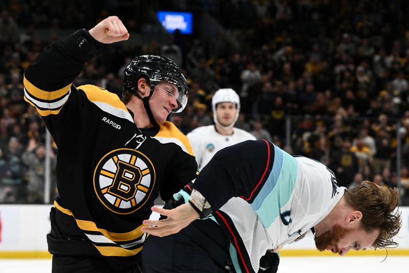 oNov 3, 2024; Boston, Massachusetts, USA; Boston Bruins center Trent Frederic (11) fights Seattle Kraken defenseman Adam Larsson (6) during the third period at the TD Garden. Mandatory Credit: Brian Fluharty-Imagn Images