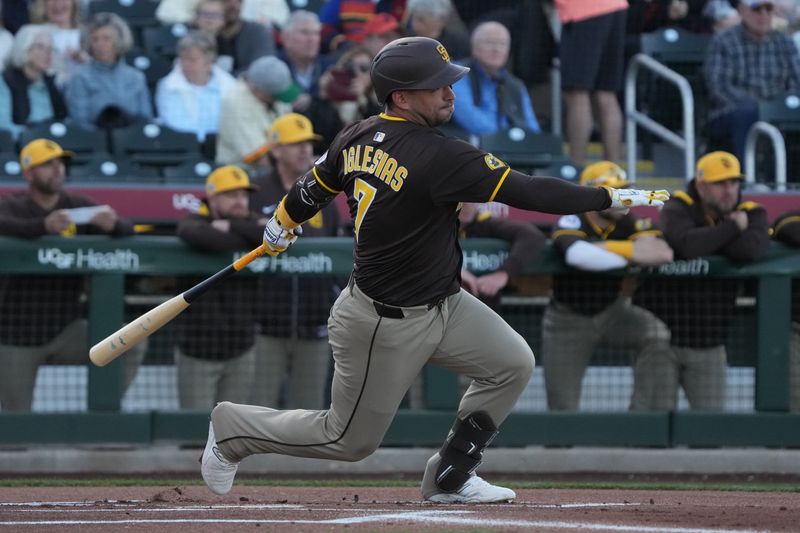 Mar 18, 2025; Scottsdale, Arizona, USA; San Diego Padres Jose Iglesias hits against the San Francisco Giants in the first inning at Scottsdale Stadium. Mandatory Credit: Rick Scuteri-Imagn Images