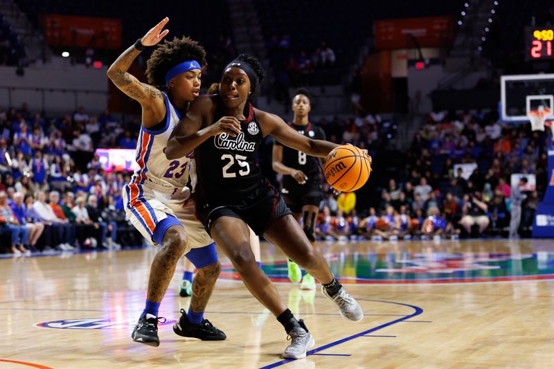 Jan 4, 2026; Gainesville, Florida, USA; South Carolina Gamecocks guard Raven Johnson (25) drives to the basket past Florida Gators guard Liv McGill (23) during the first half at Exactech Arena at the Stephen C. O'Connell Center. Mandatory Credit: Matt Pendleton-Imagn Images