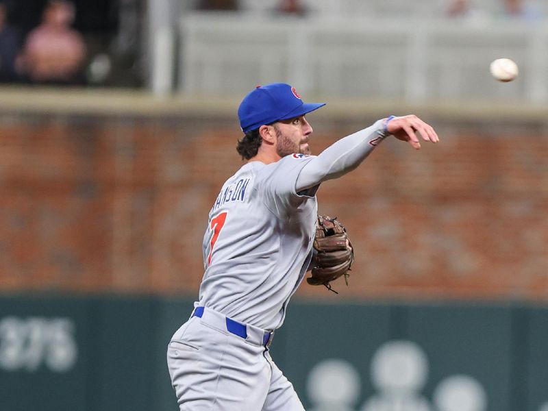 Sep 9, 2025; Cumberland, Georgia, USA; Chicago Cubs shortstop Dansby Swanson (7) throws the ball to first base for an out against the Atlanta Braves during the eighth inning at Truist Park. Mandatory Credit: Jordan Godfree-Imagn Images