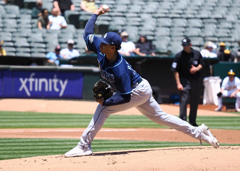 Jun 15, 2023; Oakland, California, USA; Tampa Bay Rays starting pitcher Taj Bradley (45) pitches the ball against the Oakland Athletics during the first inning at Oakland-Alameda County Coliseum. Mandatory Credit: Kelley L Cox-USA TODAY Sports