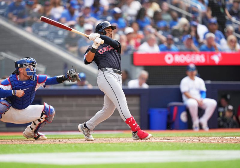 Jun 15, 2024; Toronto, Ontario, CAN; Cleveland Guardians designated hitter Steven Kwan (38) hits a single against the Toronto Blue Jays during the eighth inning at Rogers Centre. Mandatory Credit: Nick Turchiaro-USA TODAY Sports