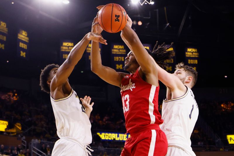 Feb 8, 2023; Ann Arbor, Michigan, USA;  Michigan Wolverines guard Jace Howard (25) Nebraska Cornhuskers forward Derrick Walker (13) and center Hunter Dickinson (1) go for the rebound in the second half at Crisler Center. Mandatory Credit: Rick Osentoski-USA TODAY Sports