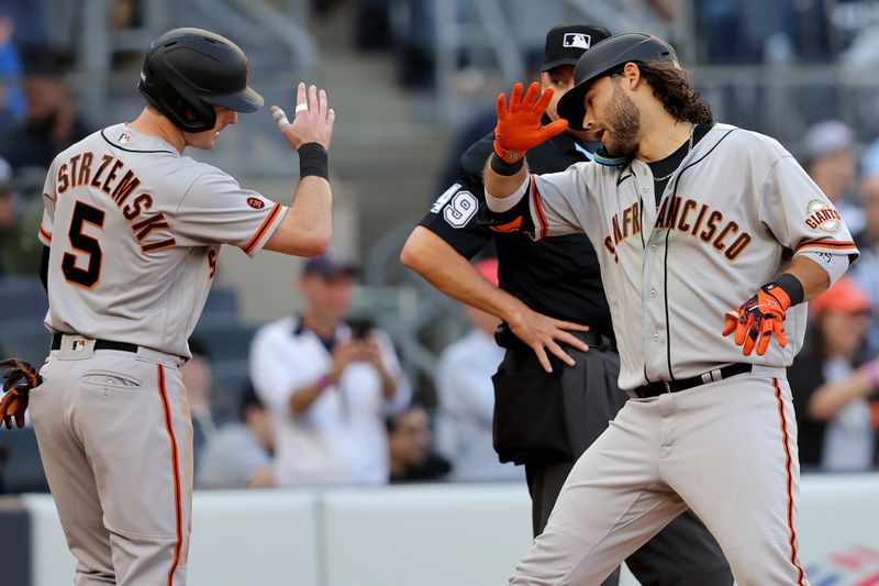 Apr 1, 2023; Bronx, New York, USA; San Francisco Giants shortstop Brandon Crawford (35) celebrates his two run home run against the New York Yankees with center fielder Mike Yastrzemski (5) during the fourth inning at Yankee Stadium. Mandatory Credit: Brad Penner-USA TODAY Sports