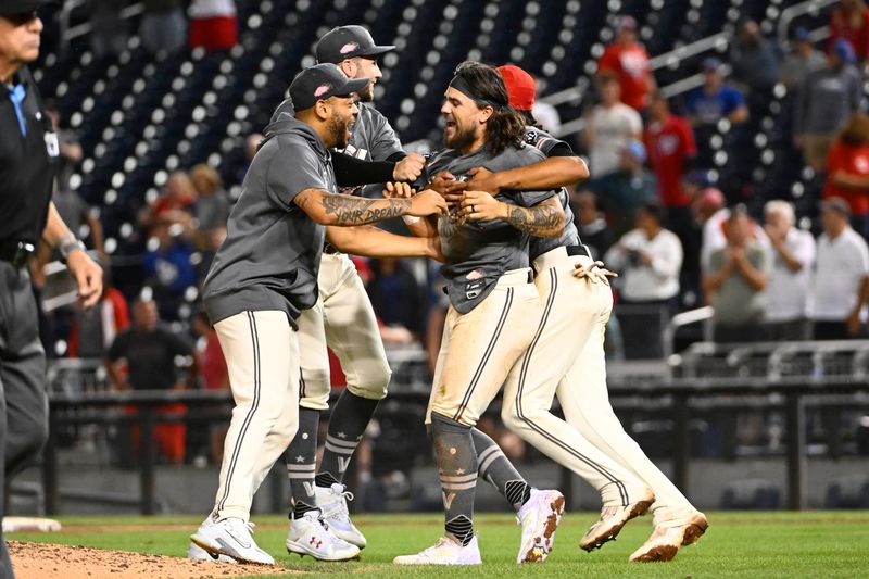 Sep 9, 2023; Washington, District of Columbia, USA; Washington Nationals second baseman Michael Chavis (6) is congratulated by teammates after scoring the winning run during the eleventh inning against the Los Angeles Dodgers at Nationals Park. Mandatory Credit: Brad Mills-USA TODAY Sports