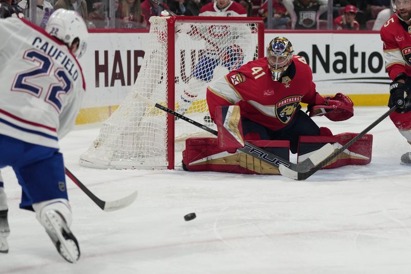 Dec 30, 2023; Sunrise, Florida, USA; Montreal Canadiens right wing Cole Caufield (22) takes a shot at goal as Florida Panthers goaltender Anthony Stolarz (41) defends during the first period at Amerant Bank Arena. Mandatory Credit: Jim Rassol-USA TODAY Sports