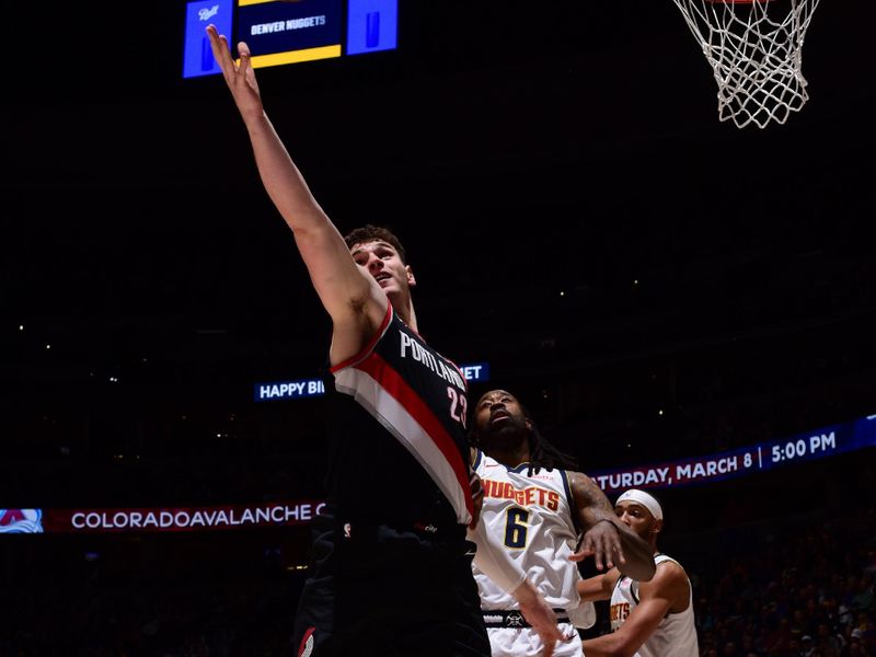 DENVER, CO - FEBRUARY 10: Donovan Clingan #23 of the Portland Trail Blazers rebounds the ball during the game against the Denver Nuggets on February 10, 2025 at Ball Arena in Denver, Colorado. NOTE TO USER: User expressly acknowledges and agrees that, by downloading and/or using this Photograph, user is consenting to the terms and conditions of the Getty Images License Agreement. Mandatory Copyright Notice: Copyright 2025 NBAE (Photo by Garrett Ellwood/NBAE via Getty Images)