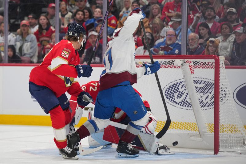 Nov 23, 2024; Sunrise, Florida, USA;  Colorado Avalanche left wing Jonathan Drouin (27) scores a goal against Florida Panthers goaltender Sergei Bobrovsky (72) and center Jesper Boqvist (70) in the first period at Amerant Bank Arena. Mandatory Credit: Jim Rassol-Imagn Images