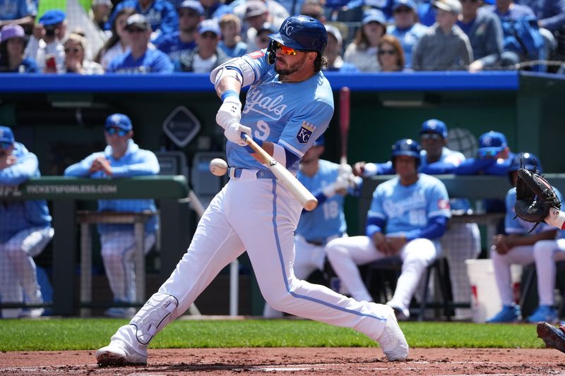 Apr 10, 2025; Kansas City, Missouri, USA; Kansas City Royals first base Vinnie Pasquantino (9) connects for a single against the Minnesota Twins  at Kauffman Stadium. Mandatory Credit: Denny Medley-Imagn Images