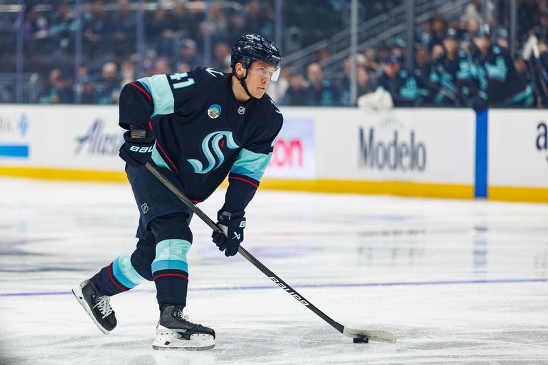 Oct 19, 2024; Seattle, Washington, USA; Seattle Kraken defenseman Ryker Evans (41) skates against the Calgary Flames during the first period at Climate Pledge Arena. Mandatory Credit: Caean Couto-Imagn Images