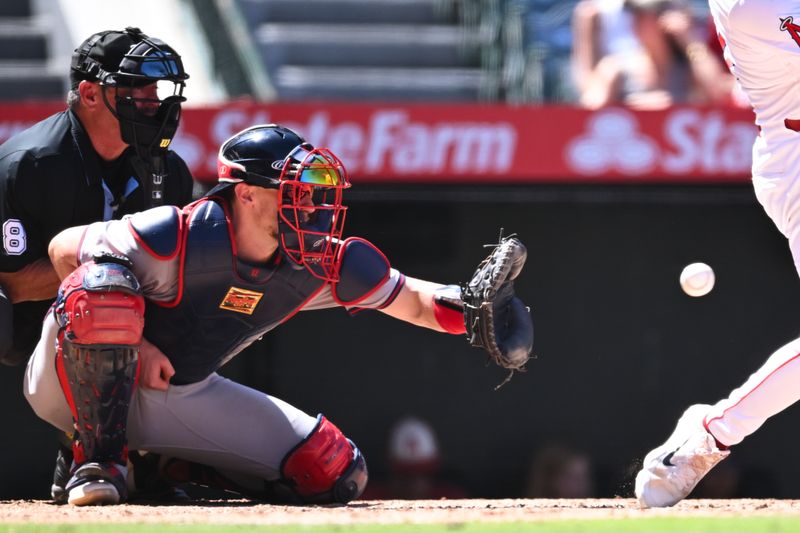 Aug 18, 2024; Anaheim, California, USA; Atlanta Braves catcher Sean Murphy (12) makes a catch against the Los Angeles Angels during the sixth inning at Angel Stadium. Mandatory Credit: Jonathan Hui-USA TODAY Sports