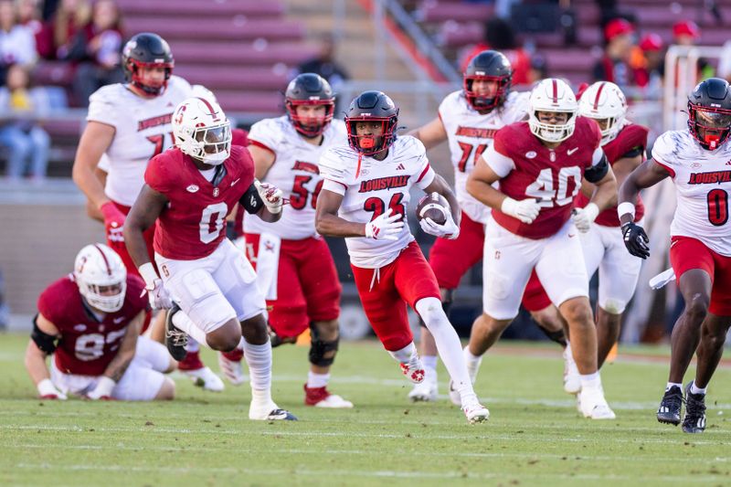 Nov 16, 2024; Stanford, California, USA;  Louisville Cardinals running back Duke Watson (26) breaks through the line during the third quarter against the Stanford Cardinal at Stanford Stadium. Mandatory Credit: Bob Kupbens-Imagn Images