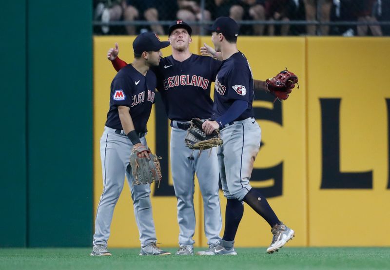 Jul 17, 2023; Pittsburgh, Pennsylvania, USA;  Cleveland Guardians left fielder Steven Kwan (left) and center fielder Myles Straw (middle) and right fielder David Fry (right) celebrate in the outfield after defeating the Pittsburgh Pirates at PNC Park. The Guardians shutout the Pirates 11-0. Mandatory Credit: Charles LeClaire-USA TODAY Sports