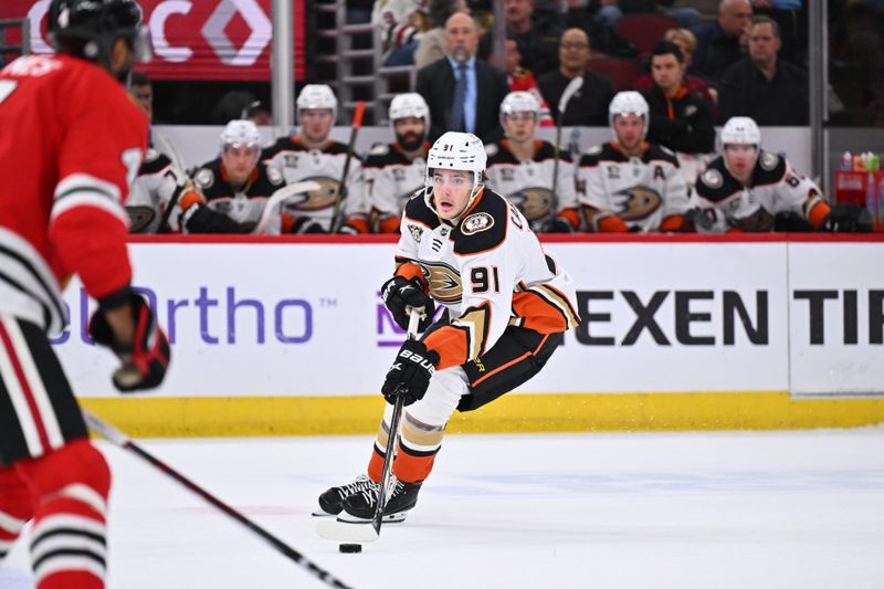 Dec 7, 2023; Chicago, Illinois, USA; Anaheim Ducks forward Leo Carlsson (91) skates the puck up ice in the second period against the Chicago Blackhawks at United Center. Mandatory Credit: Jamie Sabau-USA TODAY Sports.