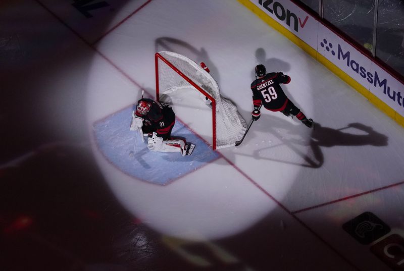 Apr 20, 2024; Raleigh, North Carolina, USA; Carolina Hurricanes goaltender Frederik Andersen (31) and center Jake Guentzel (59) skate before the game against the New York Islanders in game one of the first round of the 2024 Stanley Cup Playoffs at PNC Arena. Mandatory Credit: James Guillory-USA TODAY Sports