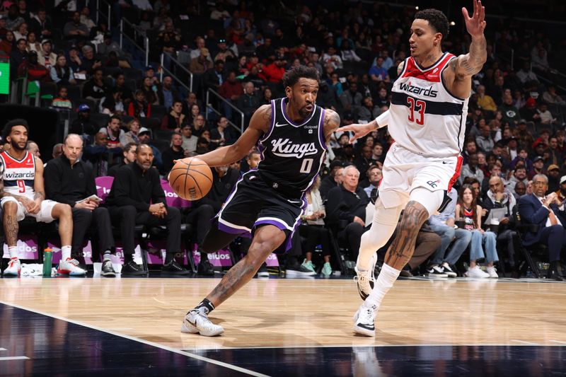 WASHINGTON, DC -? MARCH 21: Malik Monk #0 of the Sacramento Kings drives to the basket against Kyle Kuzma #33 of the Washington Wizards during the game on March 21, 2024 at Capital One Arena in Washington, DC. NOTE TO USER: User expressly acknowledges and agrees that, by downloading and or using this Photograph, user is consenting to the terms and conditions of the Getty Images License Agreement. Mandatory Copyright Notice: Copyright 2024 NBAE (Photo by Stephen Gosling/NBAE via Getty Images)