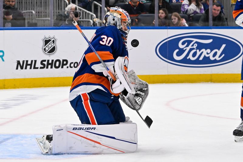 Feb 13, 2024; Elmont, New York, USA; New York Islanders goaltender Ilya Sorokin (30) makes a save against the Seattle Kraken during the third period at UBS Arena. Mandatory Credit: Dennis Schneidler-USA TODAY Sports