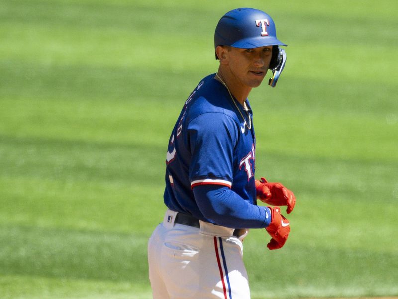 Mar 26, 2024; Arlington, Texas, USA; Texas Rangers left field Wyatt Langford (82) celebrates after hitting a double against the Boston Red Sox during the second inning at Globe Life Field. Mandatory Credit: Jerome Miron-USA TODAY Sports