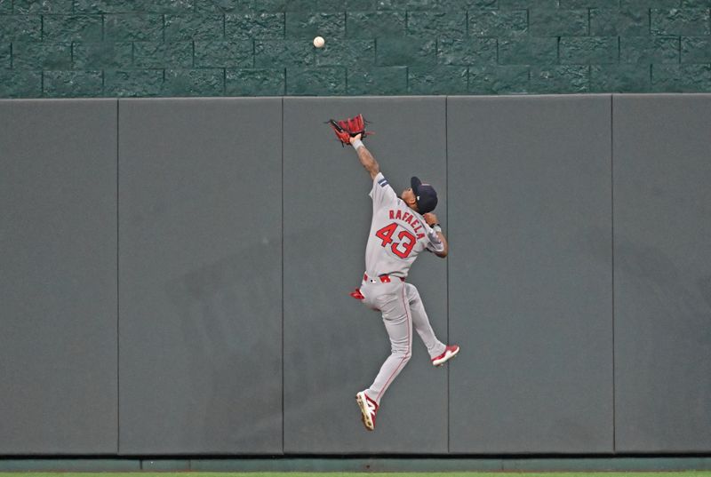 Aug 5, 2024; Kansas City, Missouri, USA;  Boston Red Sox center fielder Ceddanne Rafaela (43) catches a fly ball in front of the center field wall against Kansas City Royals Maikel Garcia (not pictured) in the fifth inning at Kauffman Stadium. Mandatory Credit: Peter Aiken-USA TODAY Sports