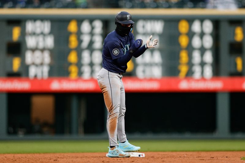 Apr 20, 2024; Denver, Colorado, USA; Seattle Mariners center fielder Julio Rodriguez (44) reacts after stealing second in the third inning against the Colorado Rockies at Coors Field. Mandatory Credit: Isaiah J. Downing-USA TODAY Sports