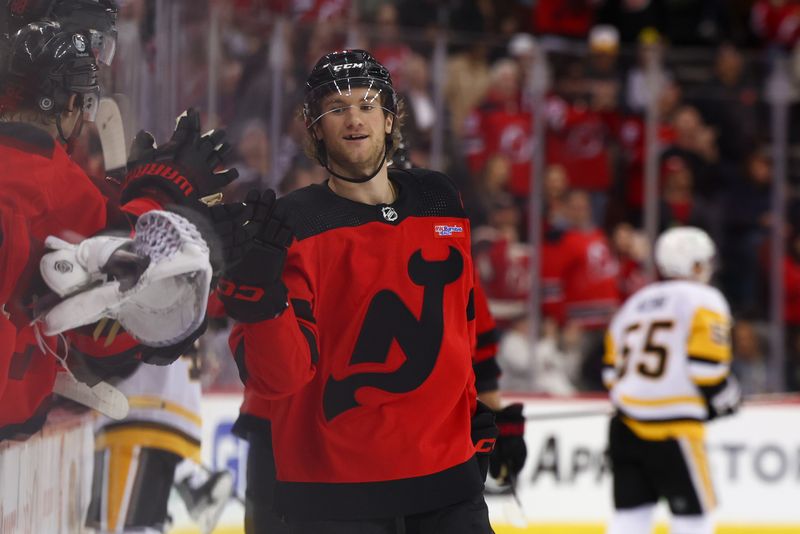 Mar 19, 2024; Newark, New Jersey, USA; New Jersey Devils center Dawson Mercer (91) celebrates his goal against the Pittsburgh Penguins during the third period at Prudential Center. Mandatory Credit: Ed Mulholland-USA TODAY Sports