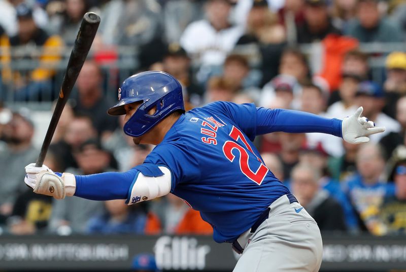 May 11, 2024; Pittsburgh, Pennsylvania, USA;  Chicago Cubs right fielder Seiya Suzuki (27) hits an infield single against the Pittsburgh Pirates during the fifth inning at PNC Park. Mandatory Credit: Charles LeClaire-USA TODAY Sports