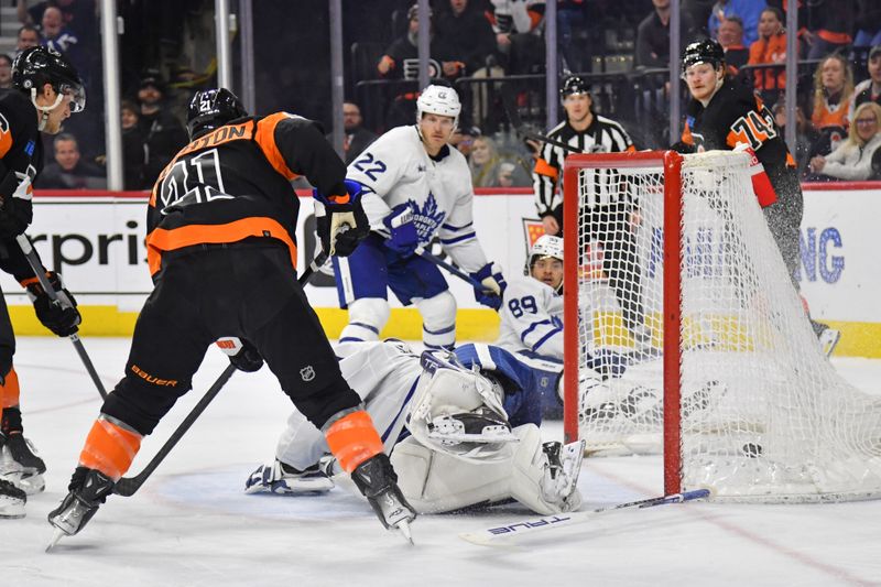 Mar 19, 2024; Philadelphia, Pennsylvania, USA; Philadelphia Flyers center Scott Laughton (21) scores a goal against Toronto Maple Leafs goaltender Ilya Samsonov (35) during the third period at Wells Fargo Center. Mandatory Credit: Eric Hartline-USA TODAY Sports