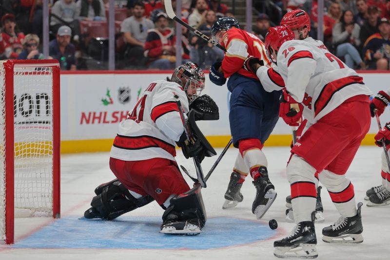 Nov 30, 2024; Sunrise, Florida, USA; Carolina Hurricanes goaltender Spencer Martin (41) makes a save against the Florida Panthers during the second period at Amerant Bank Arena. Mandatory Credit: Sam Navarro-Imagn Images