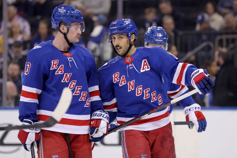 Nov 10, 2025; New York, New York, USA; New York Rangers center Vincent Trocheck (16) talks to left wing Alexis Lafreniere (13) during the first period against the Nashville Predators at Madison Square Garden. Mandatory Credit: Brad Penner-Imagn Images