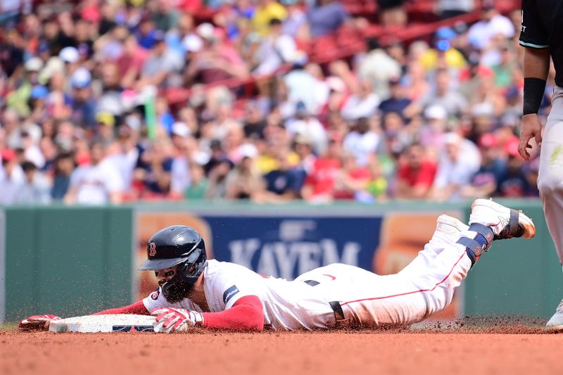 Aug 25, 2024; Boston, Massachusetts, USA; Boston Red Sox catcher Connor Wong (12) slides into second base during the fourth inning against the Arizona Diamondbacks at Fenway Park. Mandatory Credit: Eric Canha-USA TODAY Sports