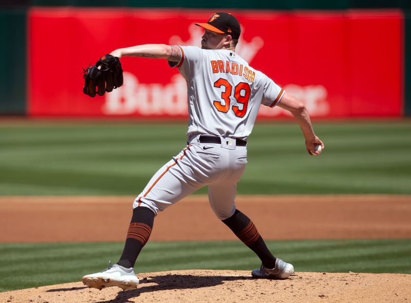 Aug 20, 2023; Oakland, California, USA; Baltimore Orioles starting pitcher Kyle Bradish (39) delivers a pitch against the Oakland Athletics during the first inning at Oakland-Alameda County Coliseum. Mandatory Credit: D. Ross Cameron-USA TODAY Sports